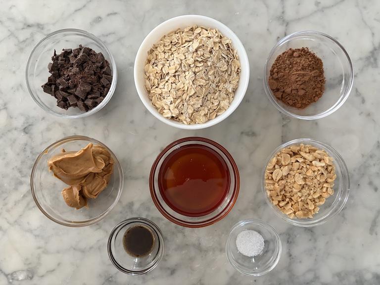 Oatmeal ball ingredients arranged on a marble surface