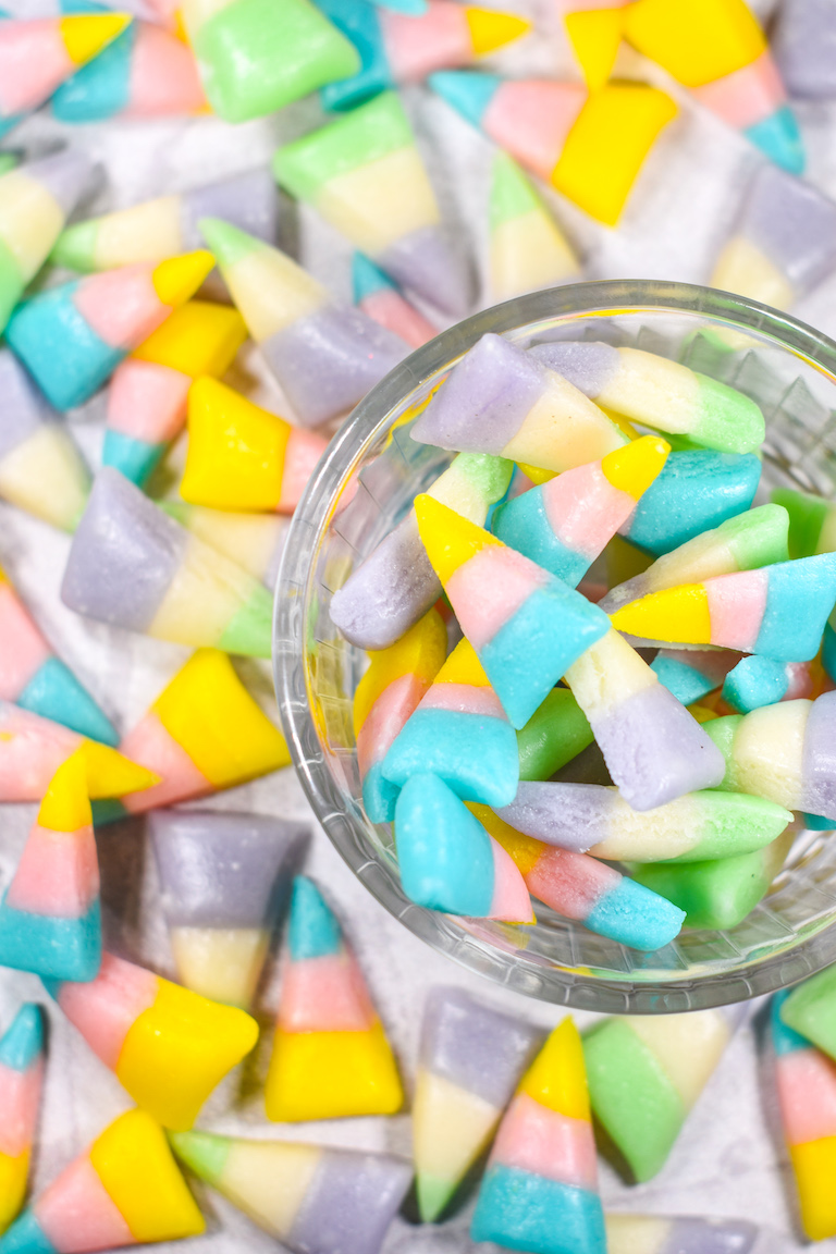 A glass bowl of pastel Easter candy corn, made from an easy candy corn recipe