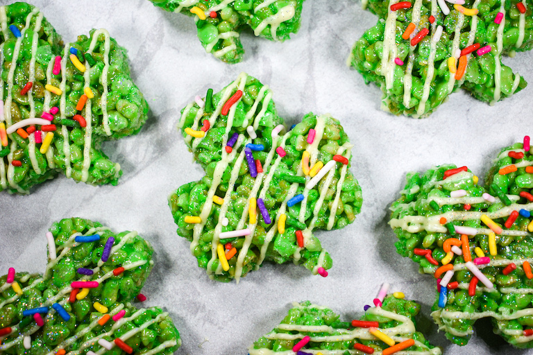 Green rice krispie treats with sprinkles and white chocolate