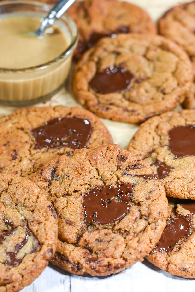 Chocolate chip cookies and a small glass dish of tahini