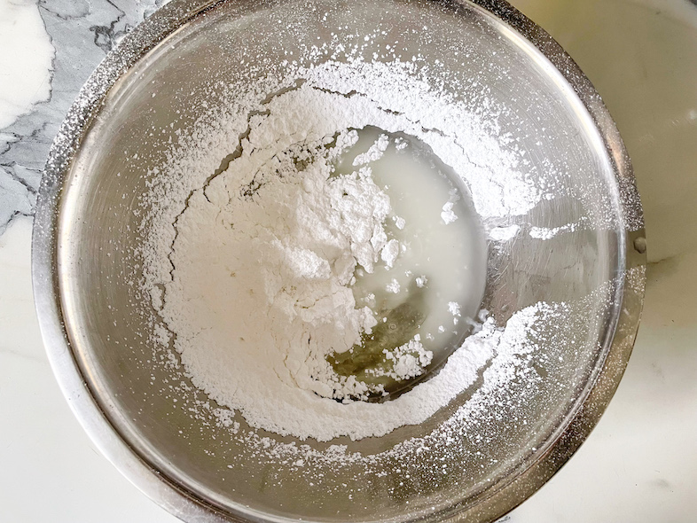 Ingredients for homemade sprinkles in a metal bowl