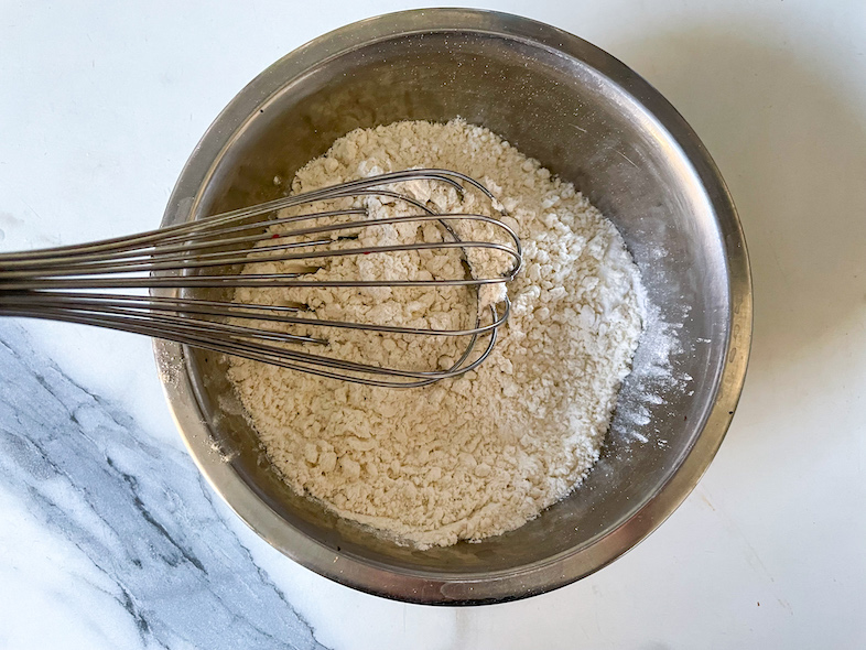 Bowl of dry ingredients and a whisk