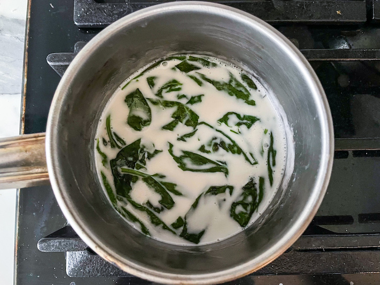 Coconut cream and basil in a pan