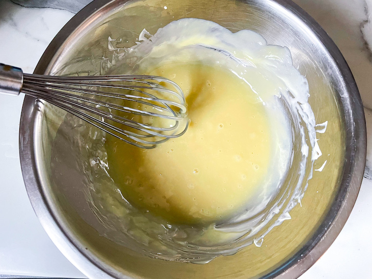 white chocolate and a whisk in a bowl