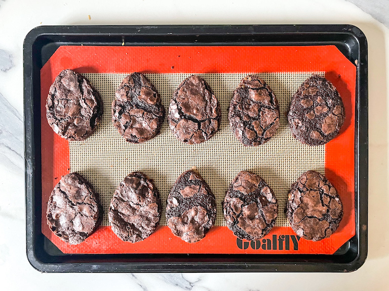 Two rows of Easter egg shaped brownies on a tray