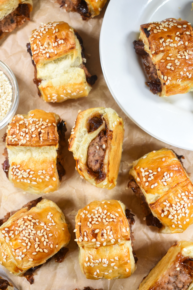 vegetarian sausage rolls arranged on a sheet of parchment