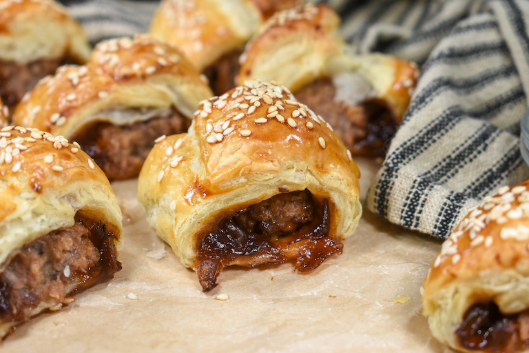 A vegetarian sausage roll with onion relish