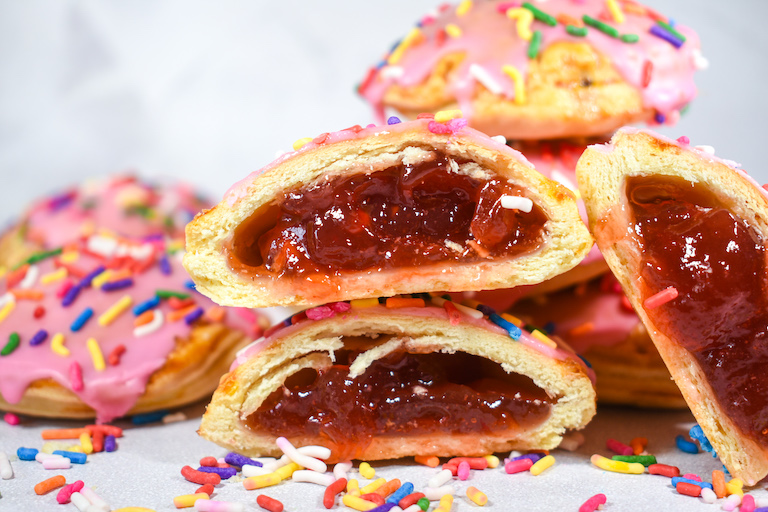 A stack of strawberry hand pies with jam filling