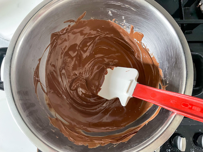 Bowl of melted chocolate on stovetop