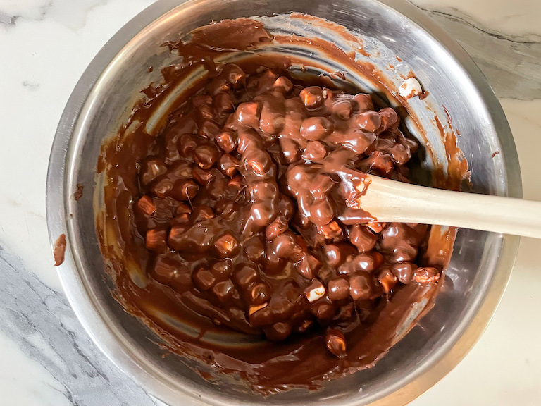 Fudge mixture in a bowl with a spoon