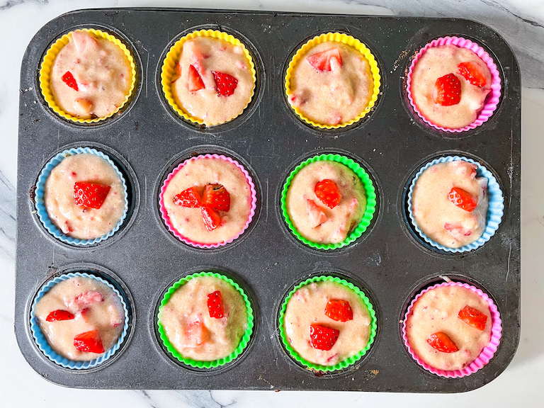 Strawberry muffin batter in silicone muffin cups