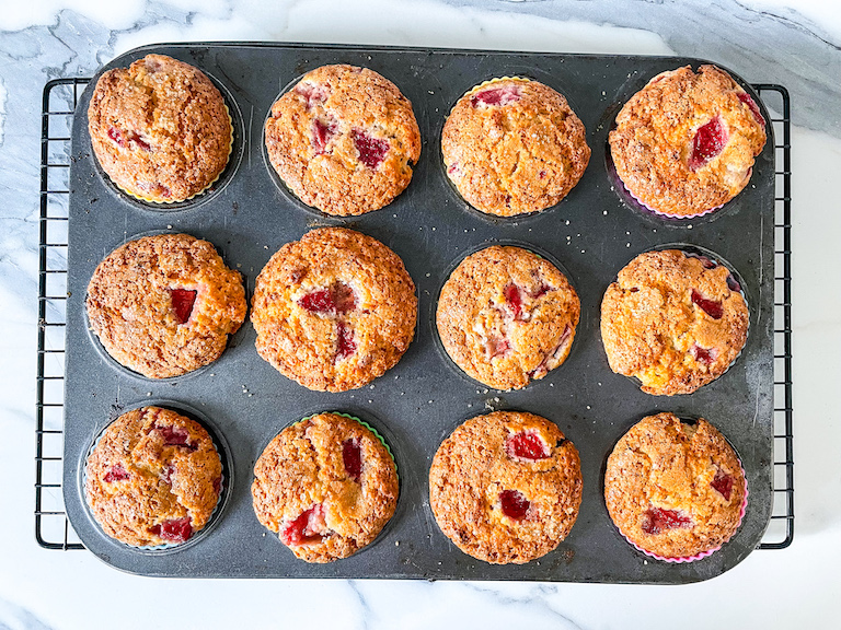 Baked strawberry muffins in a muffin tin