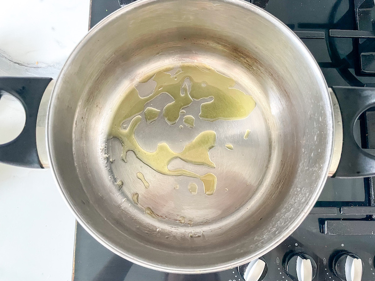 Oil drizzled in a stock pot