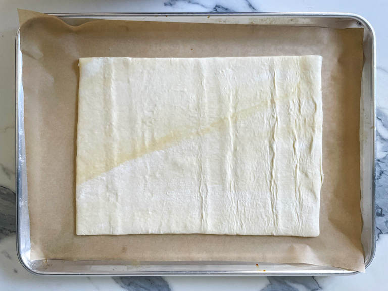 Sheet of puff pastry on a tray