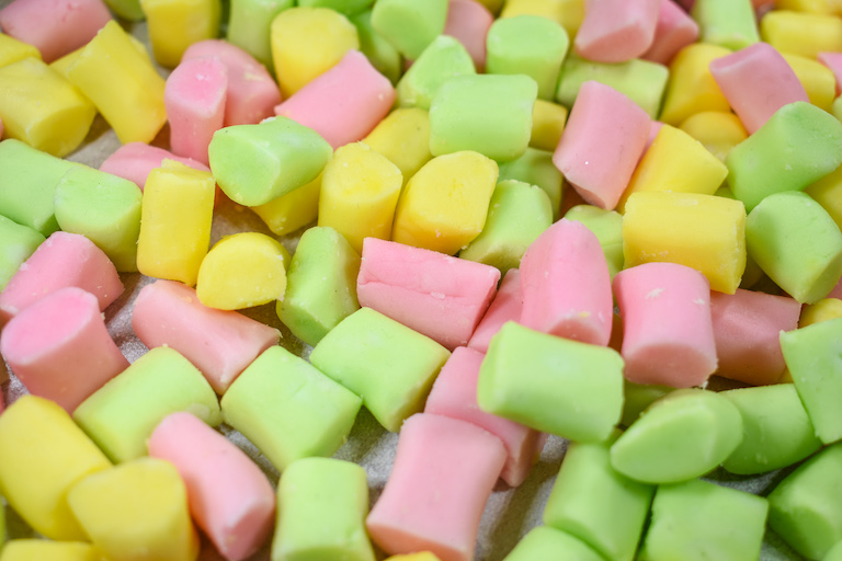 Green, pink, and yellow butter mints 