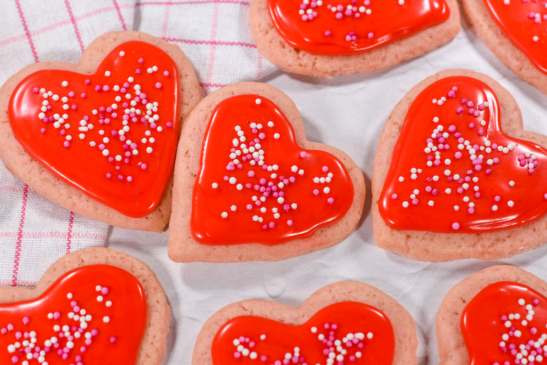 Heart shaped Valentine's Day cookies on a white surface