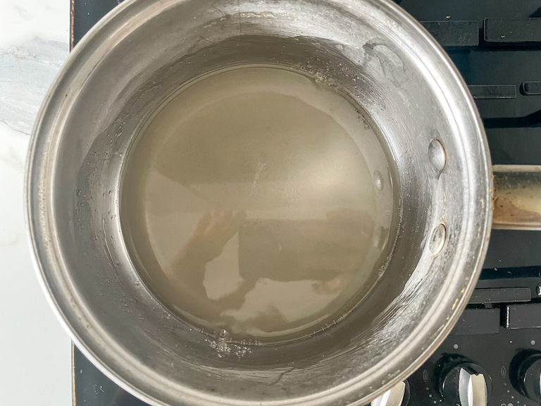 sugar and water in a pan on the stovetop