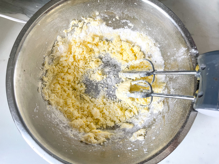 Mixer in a bowl with butter and sugar