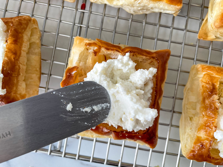 Smoothing ricotta with a small palette knife