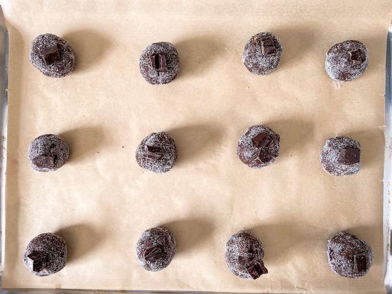 Cookie dough balls with chocolate chunks pressed on top