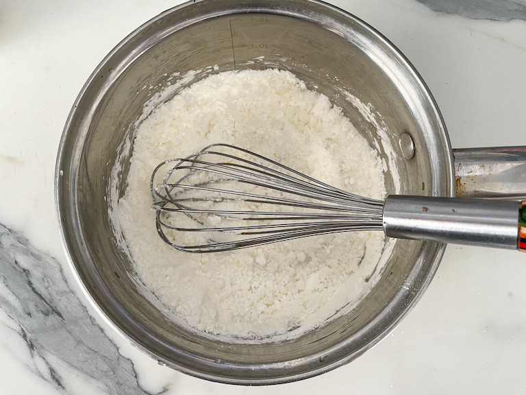 Whisk in saucepan with cornflour and sugar