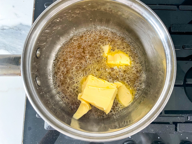 Butter and caramel bubbling in a saucepan
