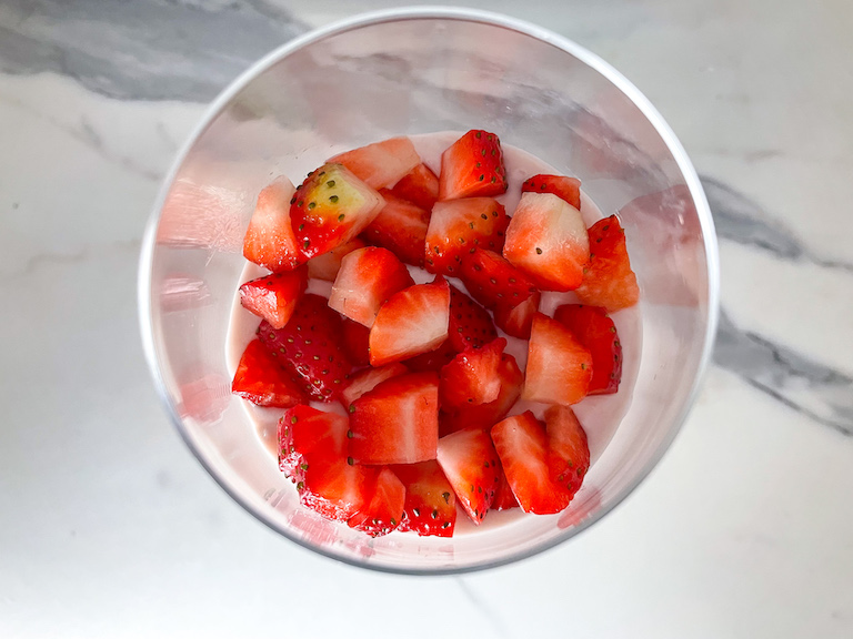 Chopped strawberries in a glass