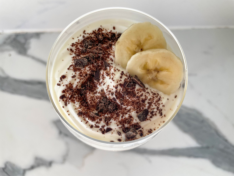 Parfait garnished with chocolate and bananas