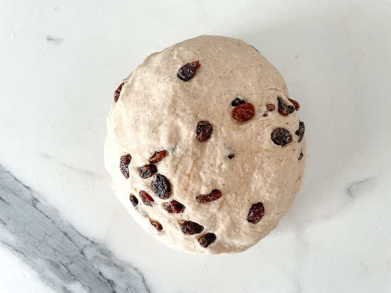 Ball of bread dough with raisins