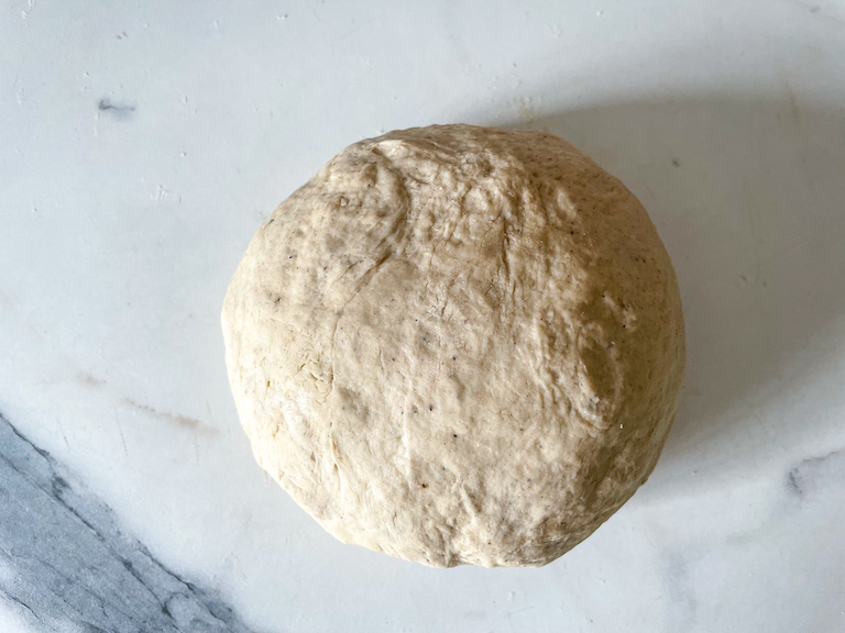 Ball of dough on countertop