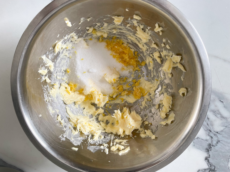 Butter, sugar, and lemon zest in a bowl