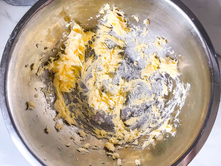 Butter in a metal mixing bowl