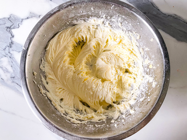 Cream pie filling in a metal mixing bowl