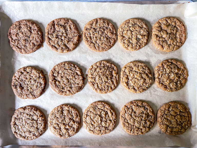Oatmeal cookies on a parchment lined tray