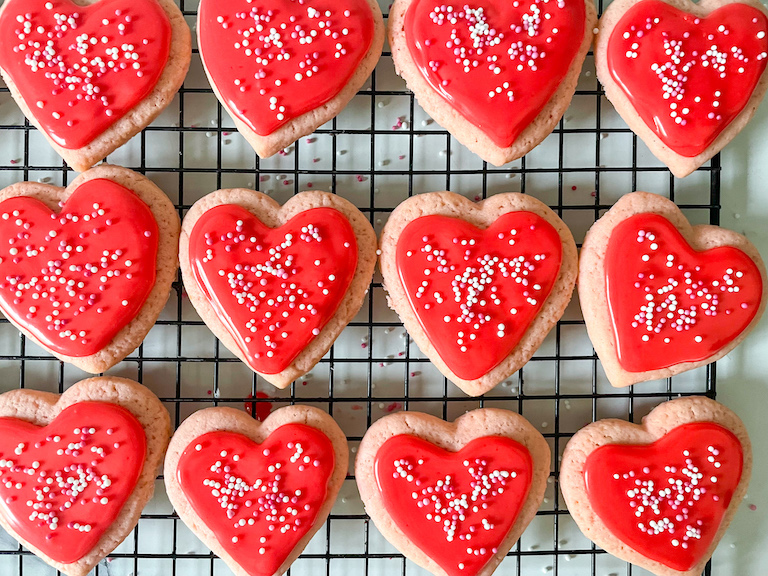 Heart cookies with red icing and sprinkles