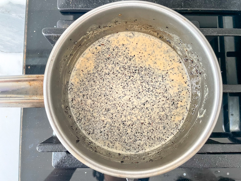 A saucepan of cream and Earl Grey tea on the stovetop