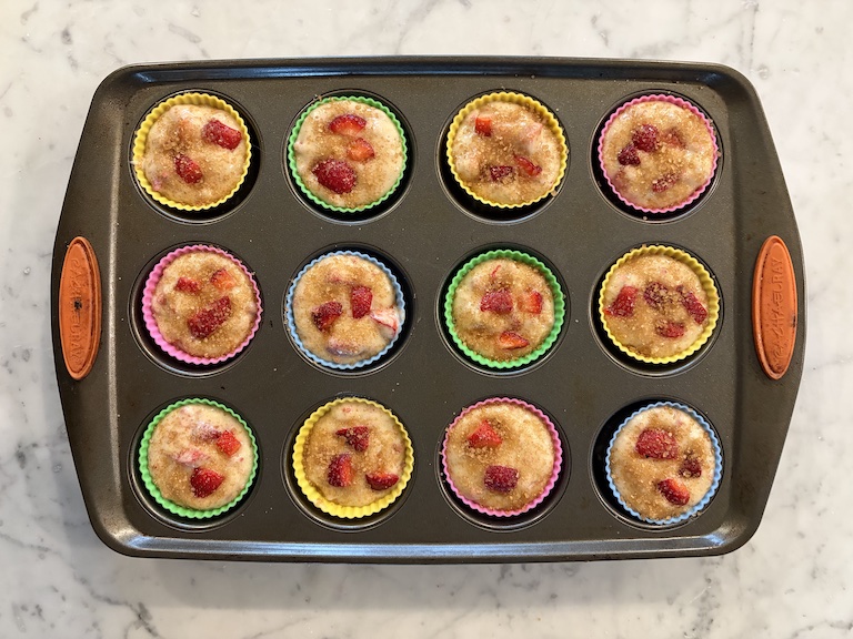 A tin of strawberry muffins