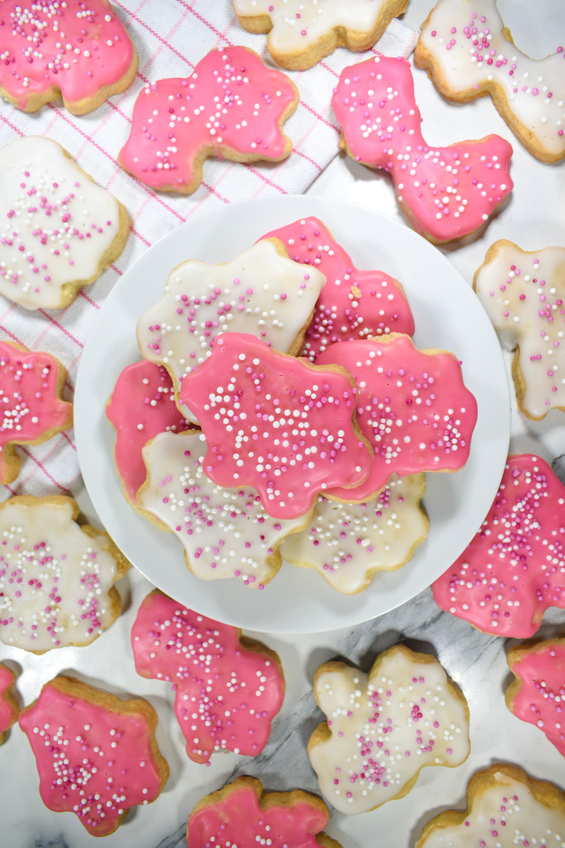 pink and white animal cookies on a white plate