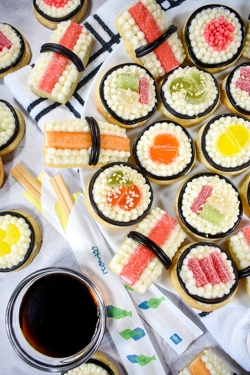 Sushi cookies, dish of soy sauce, chopsticks, and tea towel