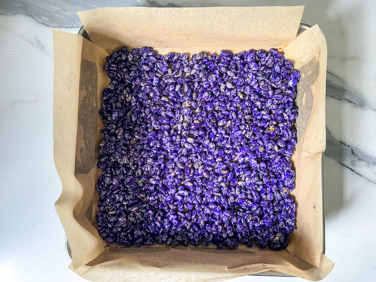 Purple layer spread in a square tin