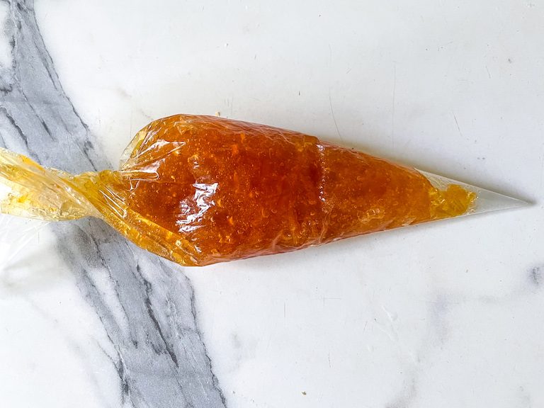 Marmalade in a clear piping bag