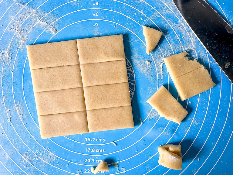 Rectangles of cookie dough and a knife