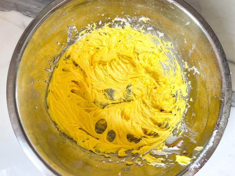 Yellow buttercream in a bowl