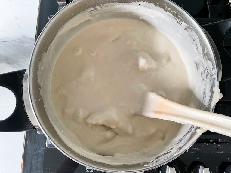 Stirring playdough ingredients in a stock pot