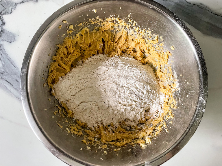 Mixing dry ingredients into butter
