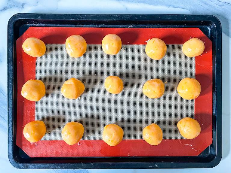 A tray of orange truffles