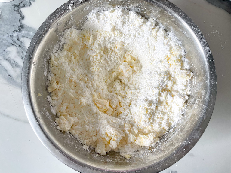 Butter and confectioner's sugar in a mixing bowl