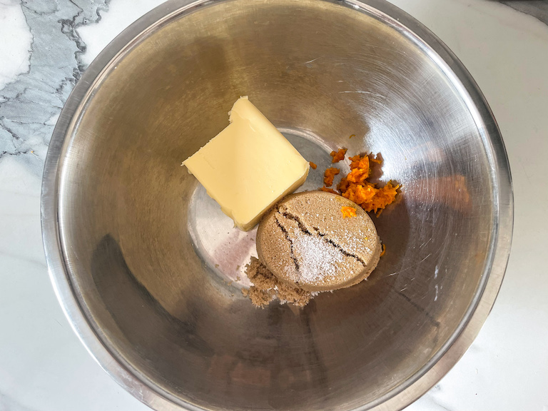 Butter, brown sugar, and orange zest in a bowl