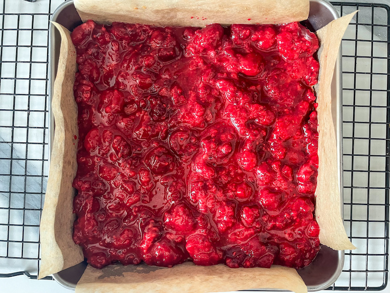 Raspberry layer spread on top of base layer