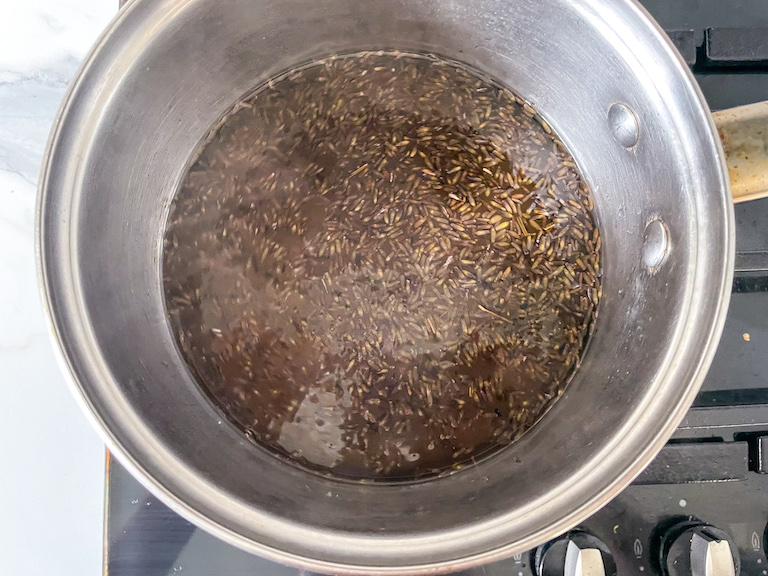Lavender syrup ingredients in a saucepan on stovetop